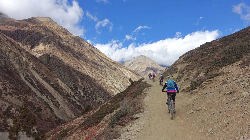 A group of World Ride mountain bikers ride in Annapurna Circuit