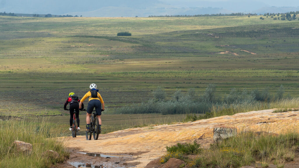 Two mountain bikers ride in Africa