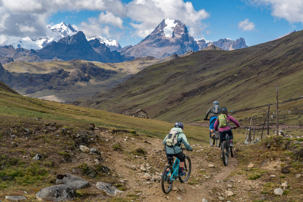 Three mountain bikers riding in the Andes in Peru.