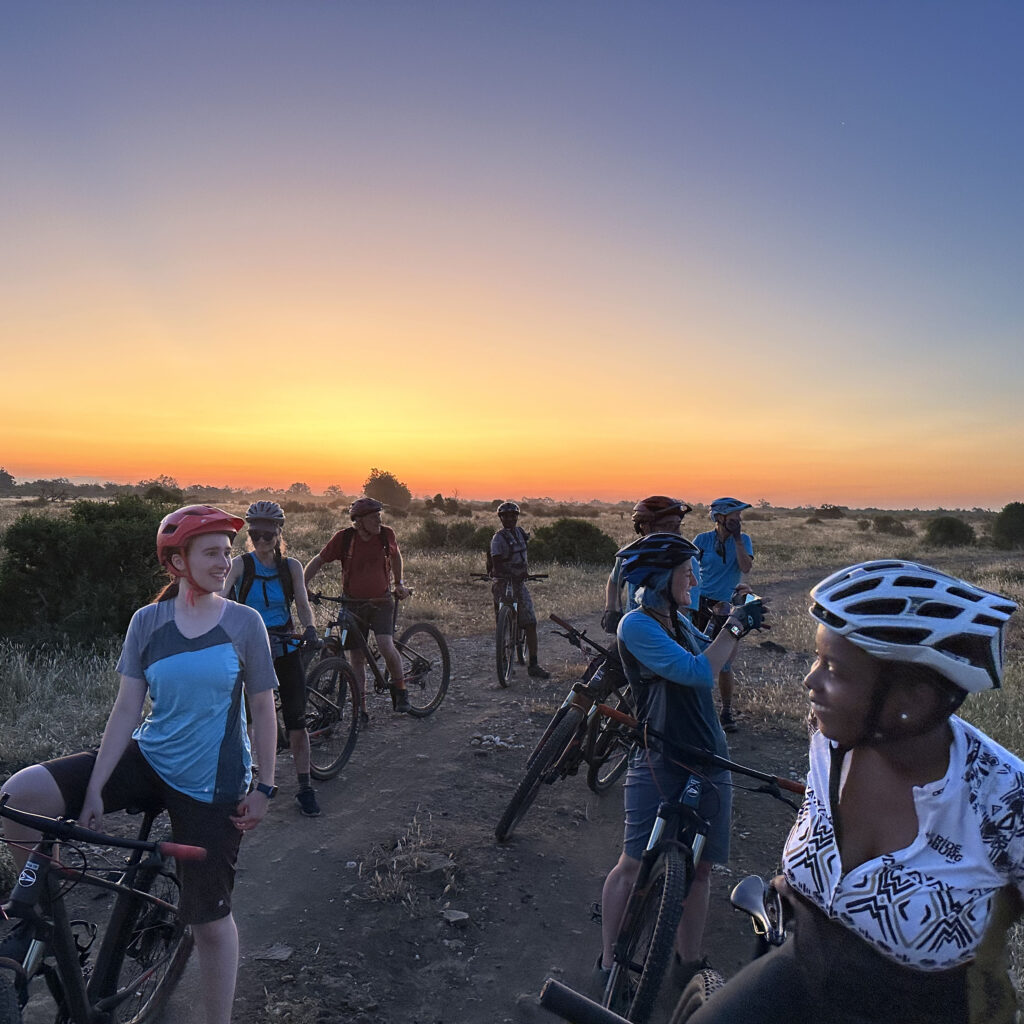 Sunset over mountain bikers in Botswana