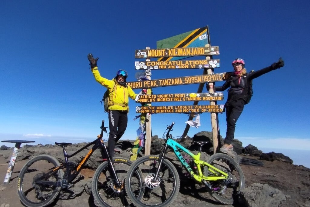 Riders on top of Mount Kilimanjaro